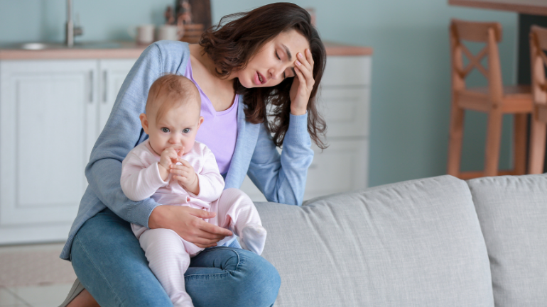 sitting in pain postpartum with perineal stitches