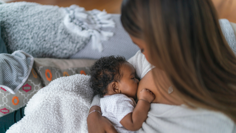 black woman breastfeeding baby